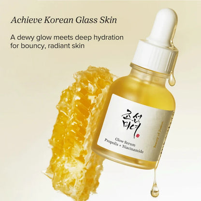 Glow Serum bottle with honeycomb and text on a beige background