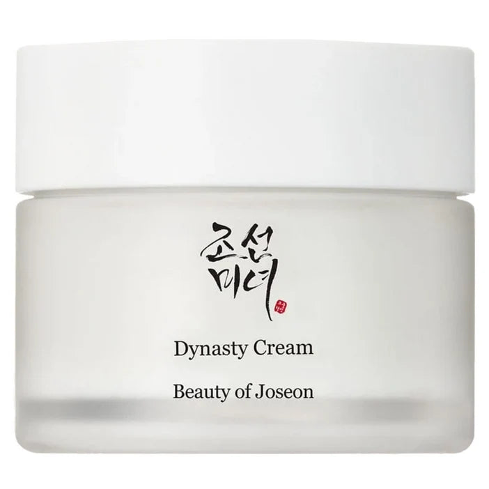 A white cosmetic cream jar with a matching white lid, featuring the brand name 'Beauty of Joseon' and the product name 'Dynasty Cream' printed on the front, alongside Korean calligraphy.