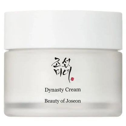 A white cosmetic cream jar with a matching white lid, featuring the brand name 'Beauty of Joseon' and the product name 'Dynasty Cream' printed on the front, alongside Korean calligraphy.