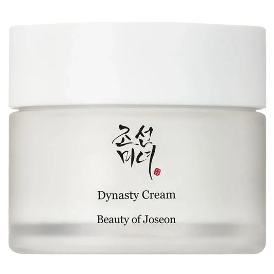 A white cosmetic cream jar with a matching white lid, featuring the brand name 'Beauty of Joseon' and the product name 'Dynasty Cream' printed on the front, alongside Korean calligraphy.