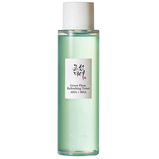 A bottle of Green Plum Refreshing Toner with AHA + BHA, featuring a light green liquid inside a clear cylindrical bottle with a white cap and a white label.