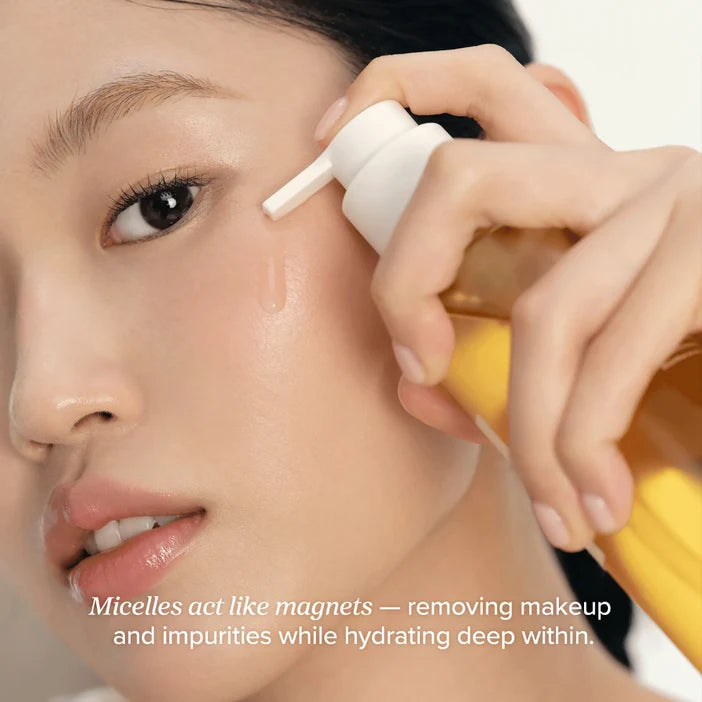 Person applying a skincare product to their face with a text overlay about micelles acting like magnets.