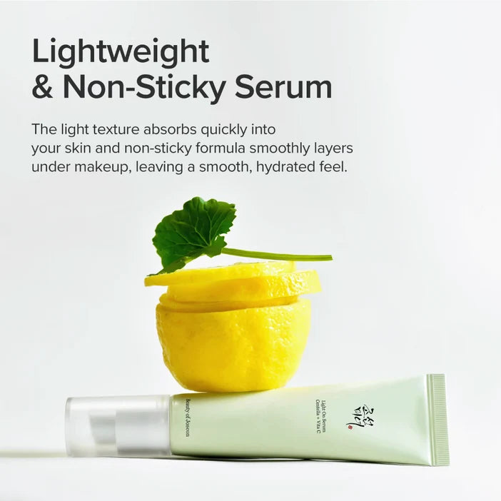 A light green cosmetic serum tube lies horizontally on a white background, styled with a sliced yellow lemon and a green leaf above it. Large text at the top reads 'Lightweight & Non-Sticky Serum' with descriptive copy about quick absorption and smooth makeup layering.
