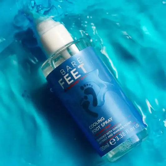 Bare Feet by Margaret Dabbs Cooling Foot Spray 100ml bottle on aqua background, refreshing foot care product with Ginger.