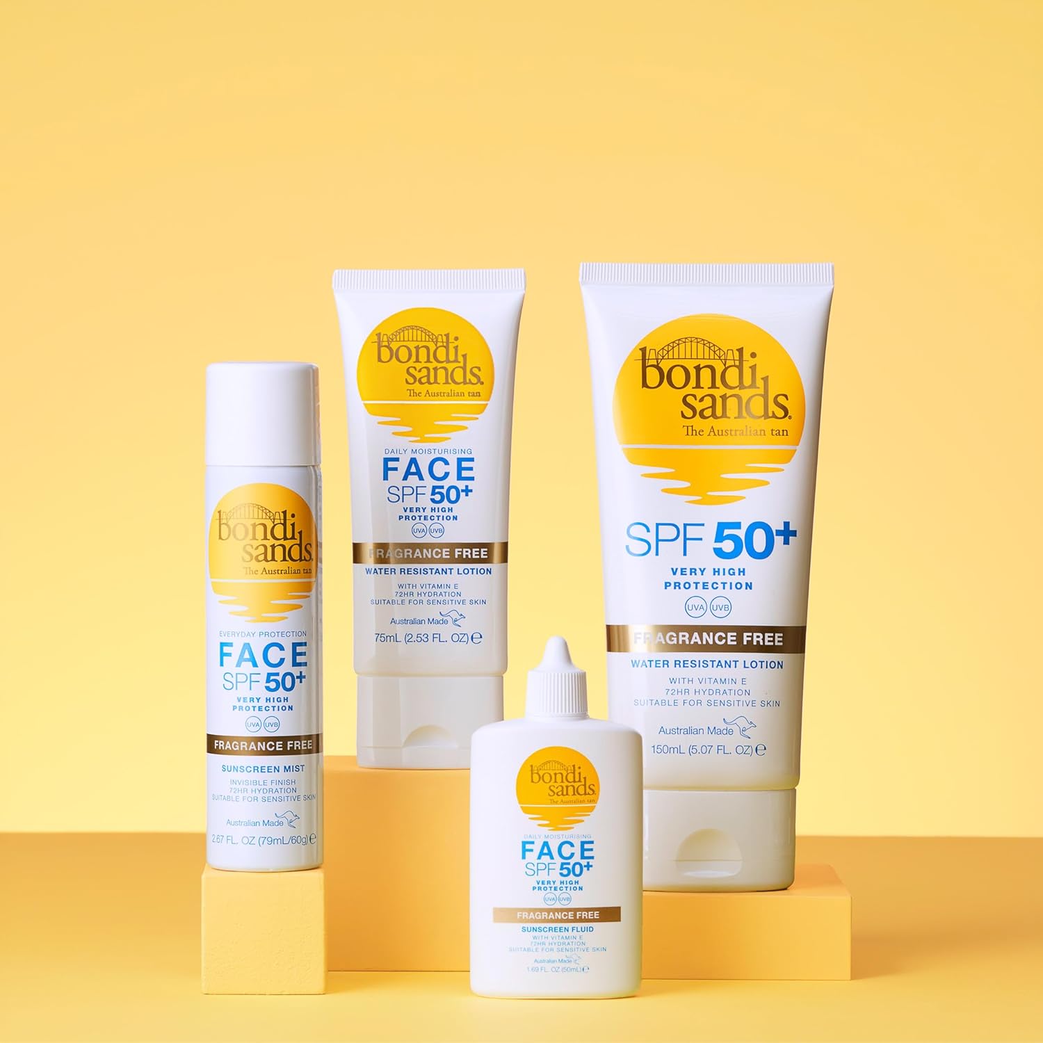 Collection of Bondi Sands sun care products on a yellow background