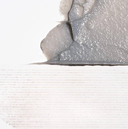 Close-up of a textured gray surface with a white background