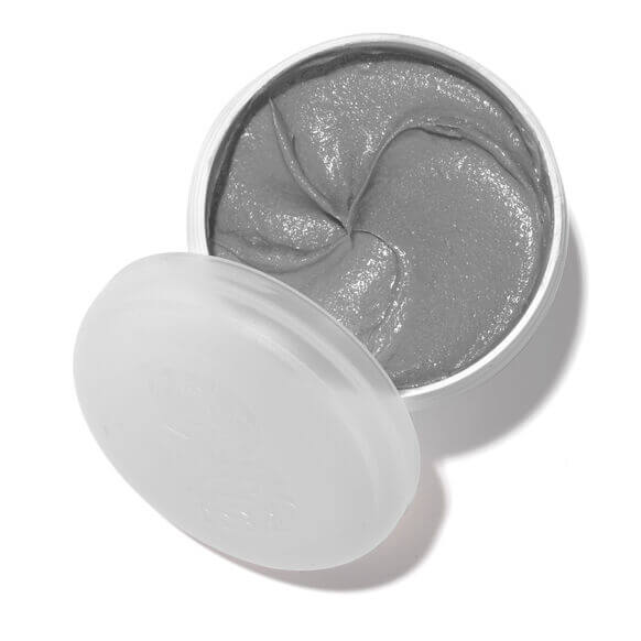 Silver gel pads in a white container on a white background