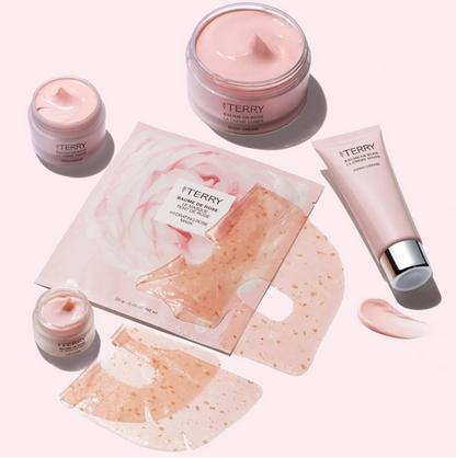 By Terry skincare products including jars, a tube, and sheet masks on a white background