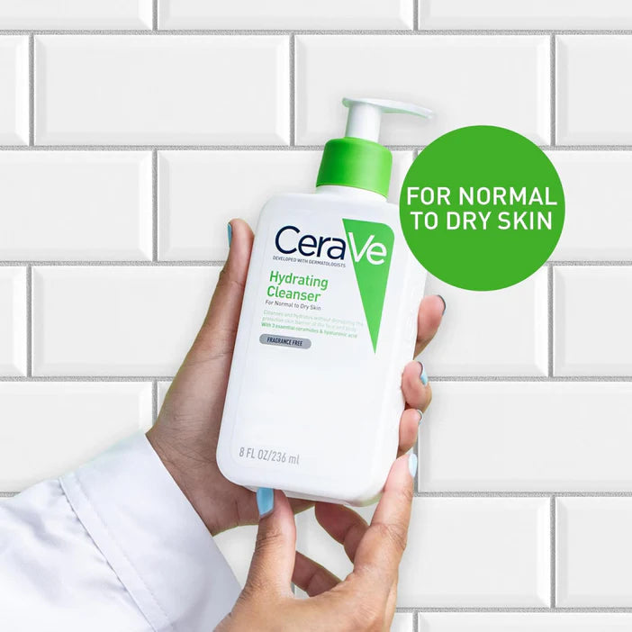 CeraVe hydrating cleanser held by a person against a tiled wall background