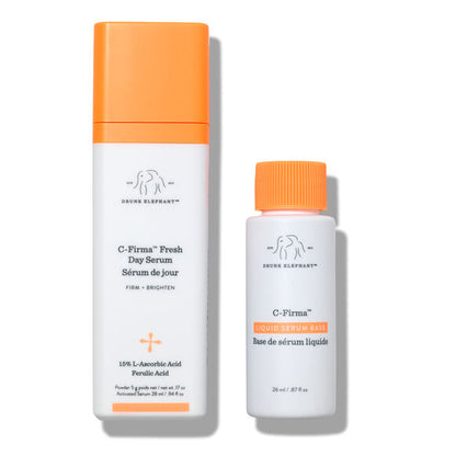 Drunk Elephant C-firma Fresh Day Serum with orange caps and white bodies on a white background