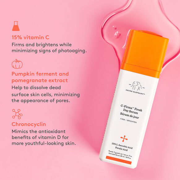 Drunk Elephant C-Firma Fresh Day Serum bottle with ingredients listed on a pink background