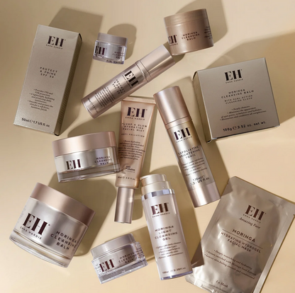 Collection of Emma Hardie skincare products on a beige background