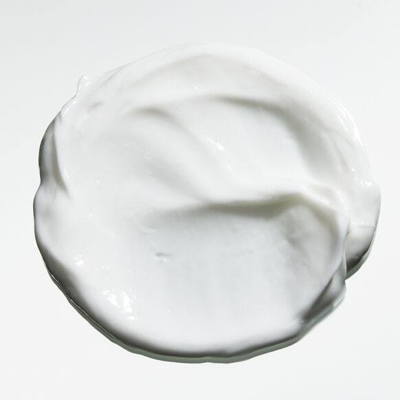 White cream or yogurt swirled on a white background
