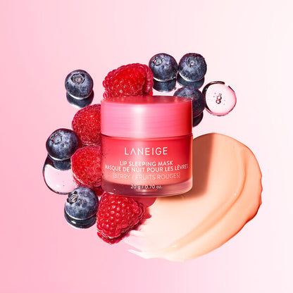 Laneige lip sleeping mask surrounded by berries on a pink background