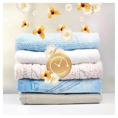 Freshly laundered clothes stacked with flowers, symbolizing the lasting scent of Lenor In-Wash Scent Booster - Gold Orchid.