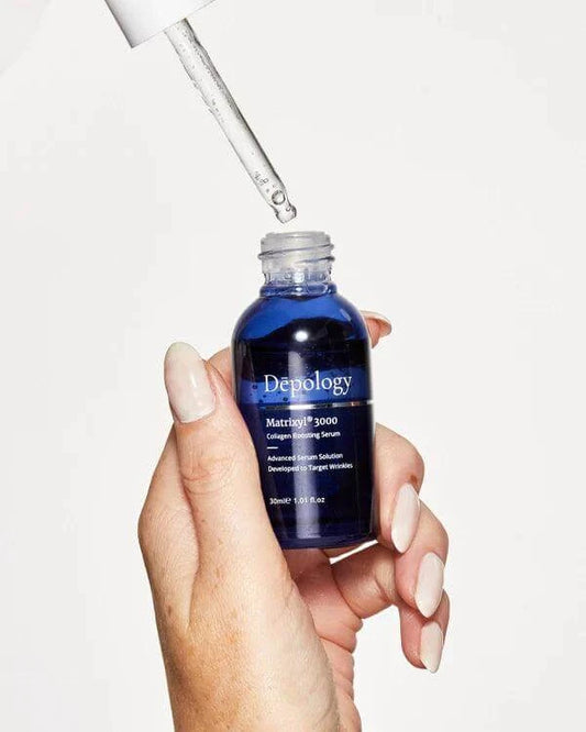 Hand holding Depology Matrixyl 3000 collagen boosting serum 30ml with dropper, promoting hydration and reducing wrinkles.