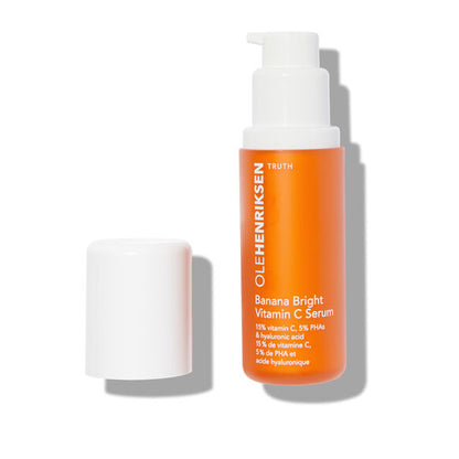 Orange OLE HENRIKSEN Banana Bright™ Vitamin C Serum bottle with white pump on a white background