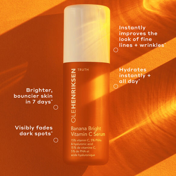 Ole Henriksen Banana Bright Vitamin C Serum bottle on an orange background with product benefits text.