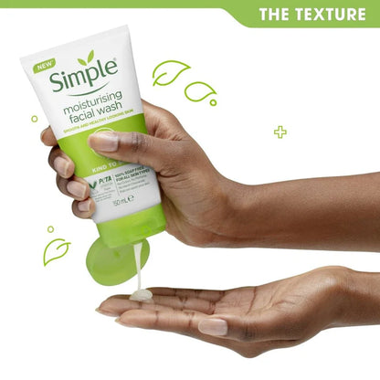 Hand holding a tube of Simple moisturising facial wash with product being squeezed onto another hand.