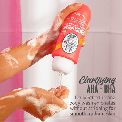 Sol de Janeiro Bom Dia Bright Clarifying AHA BHA Body Wash in use, creating a lather for smooth, radiant skin.