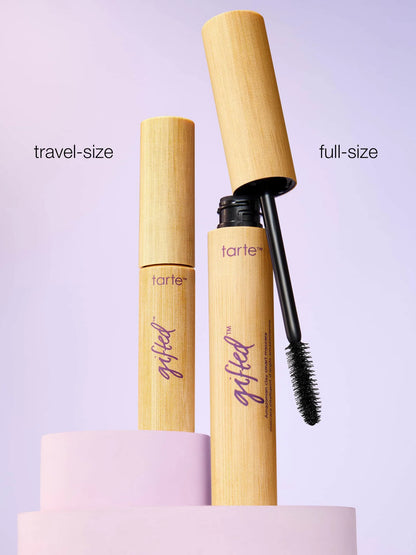 Tarte mascara in travel-size and full-size on a light purple background