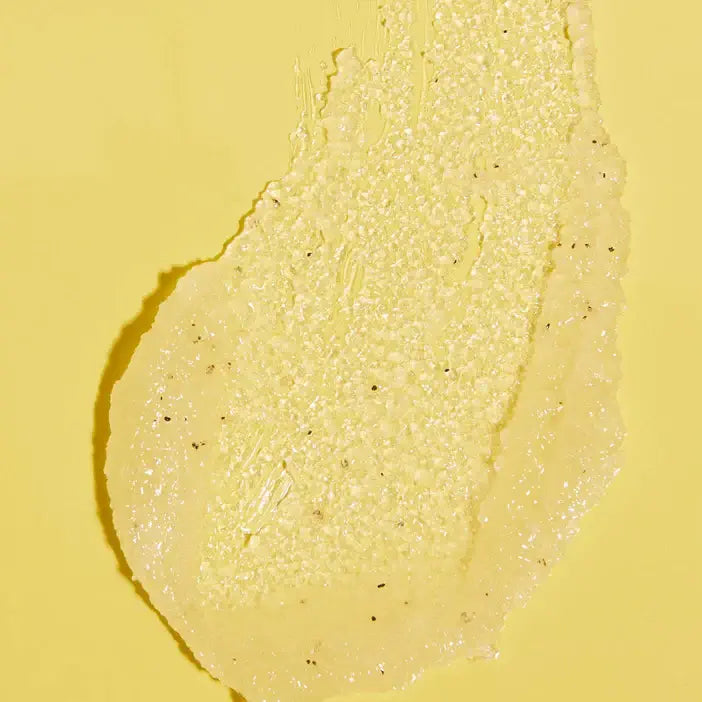 Close-up of TREE HUT Pineapple Sugar Scrub a yellow cream or paste on a yellow background