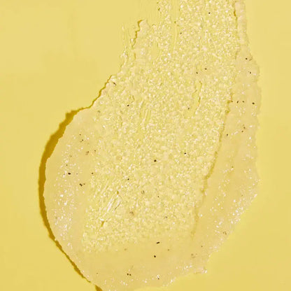 Close-up of TREE HUT Pineapple Sugar Scrub a yellow cream or paste on a yellow background