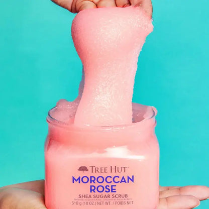 TREE HUT Sugar Scrub Moroccan Rose showing pink exfoliating scrub being poured from jar