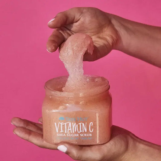 Jar of TREE HUT Vitamin C Shea Sugar Scrub with pink background