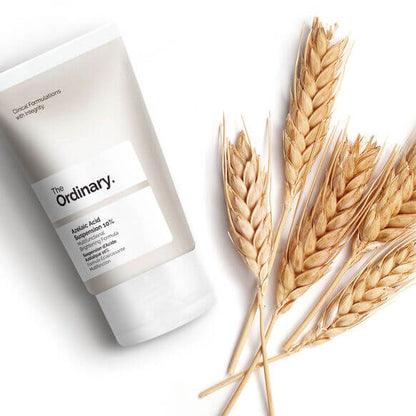 The Ordinary Azelaic Acid Suspension 10% 30ml with wheat stalks for natural skincare enhancement.