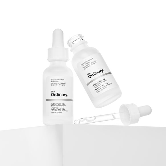 Two bottles of 'The Ordinary' serum with a dropper on a white background
