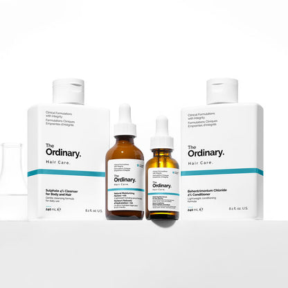 The Ordinary hair care products on a white background