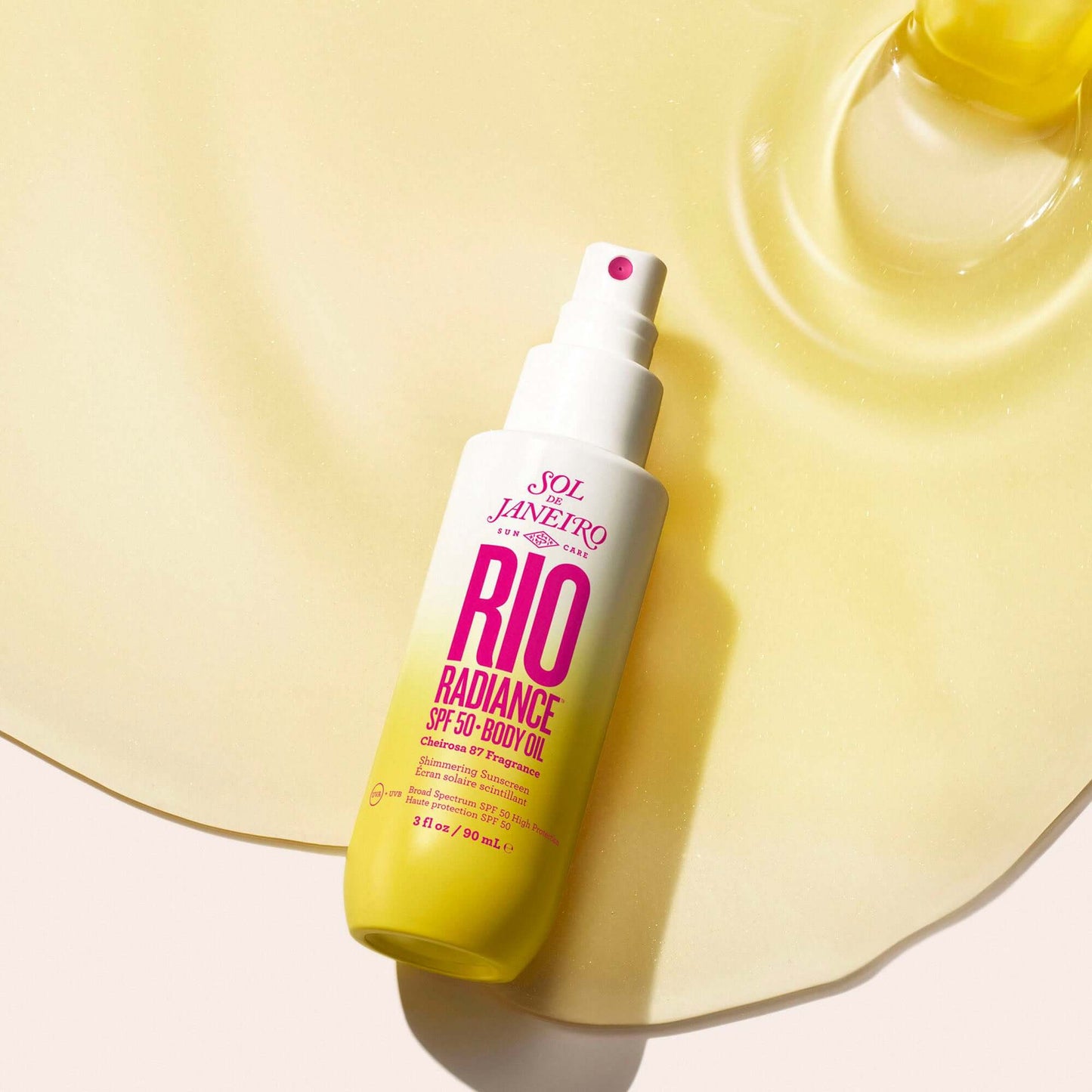Sol de Janeiro Rio Radiance Oil SPF 50 body oil on a glossy surface for hydration and sun protection.