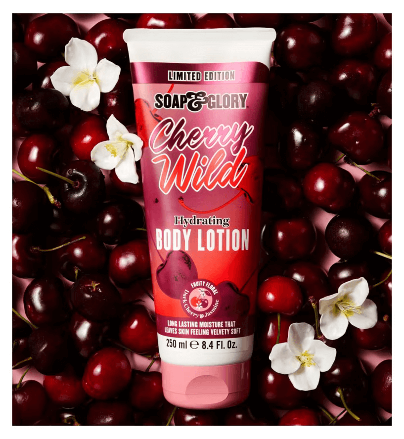 Soap & Glory Cherry Wild limited edition hydrating body lotion with dark cherries and jasmine blossoms on pink background.