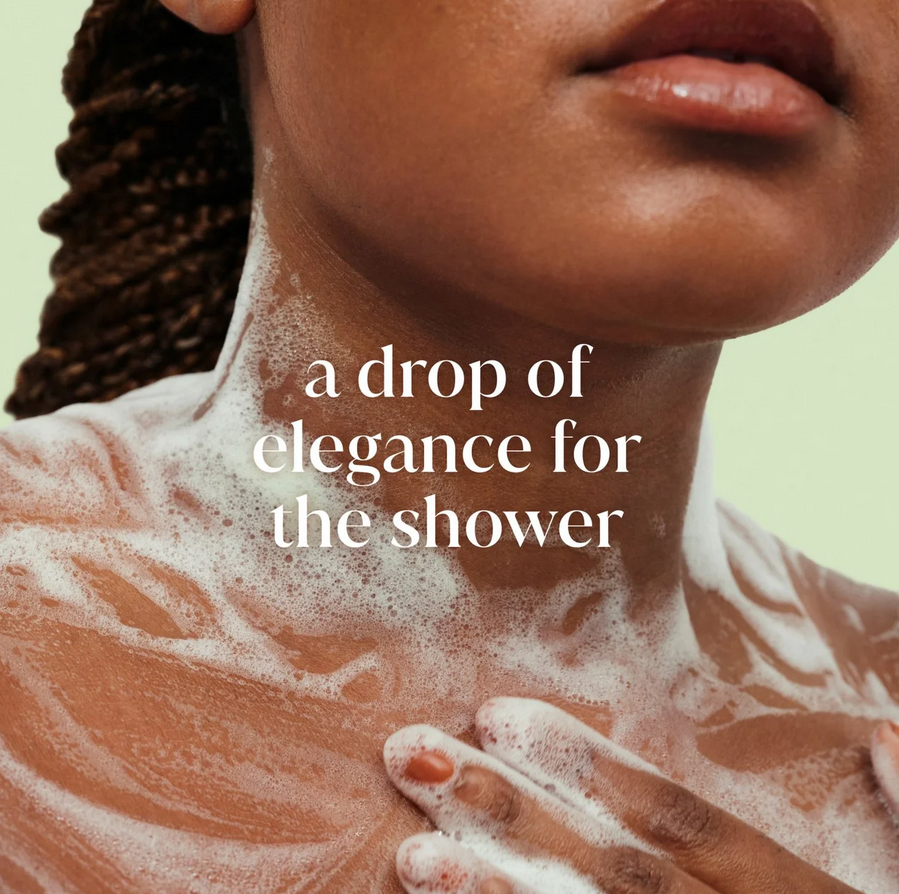 Person with Dove soap suds on a green background with text 'a drop of elegance for the shower'.