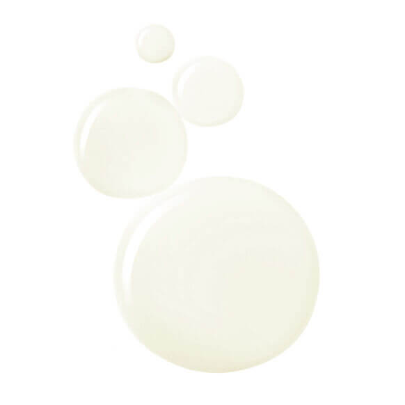 Alpha-H Liquid Gold with 5% Glycolic Acid, showcasing a creamy texture in circular droplets.