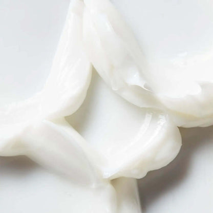 Close-up of AMELIORATE® Intensive Foot Treatment cream, showcasing its rich, smooth texture ideal for dry feet.