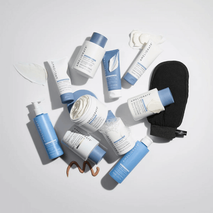 Collection of AMELIORATE skincare products with blue and white packaging on a light gray background