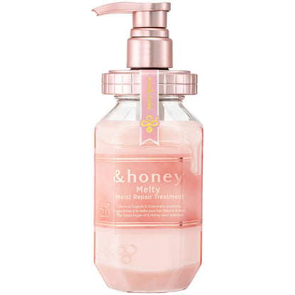 Pink bottle with pump dispenser labeled '&honey' on a white background