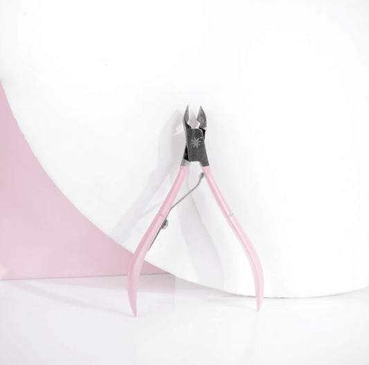 Brushworks Cuticle Nippers with pink handles on a white background, perfect for a clean and pain-free manicure.