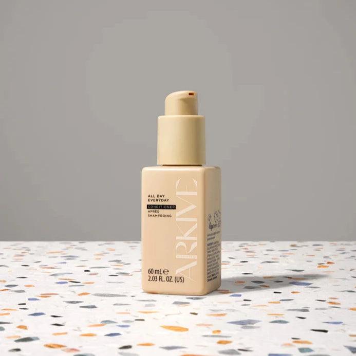 ARKIVE All Day Everyday Conditioner bottle on a speckled surface, 60ml size for luxurious hair care.