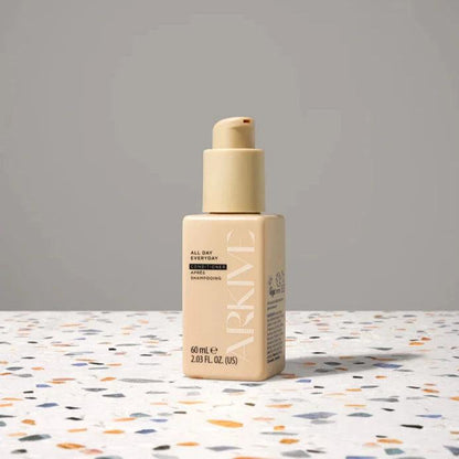 ARKIVE All Day Everyday Conditioner bottle on a speckled surface, 60ml size for luxurious hair care.