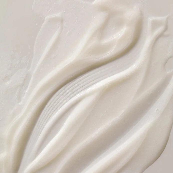 Close-up of luxurious ARKIVE All Day Everyday Conditioner, showcasing its rich, creamy texture for superior hair care.
