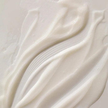 Close-up of luxurious ARKIVE All Day Everyday Conditioner, showcasing its rich, creamy texture for superior hair care.