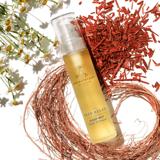 Aromatherapy Associates Deep Relax Sleep Mist 50ml with vetivert and chamomile, surrounded by floral elements.