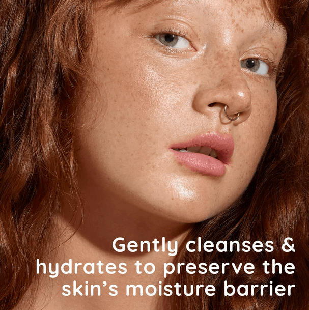 Close-up of model with healthy skin highlighting gentle cleansing and hydration benefits of Aveeno Face Calm Cleanser.