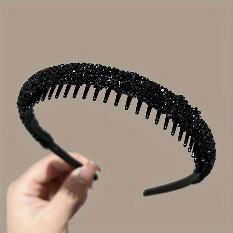 Elegant black rhinestone headband with teeth, perfect for stylish hair accessories.