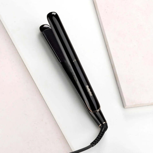 BaByliss Rose Lustre 230 hair straightener on a minimalist surface, showcasing its sleek design and ceramic coated plates.