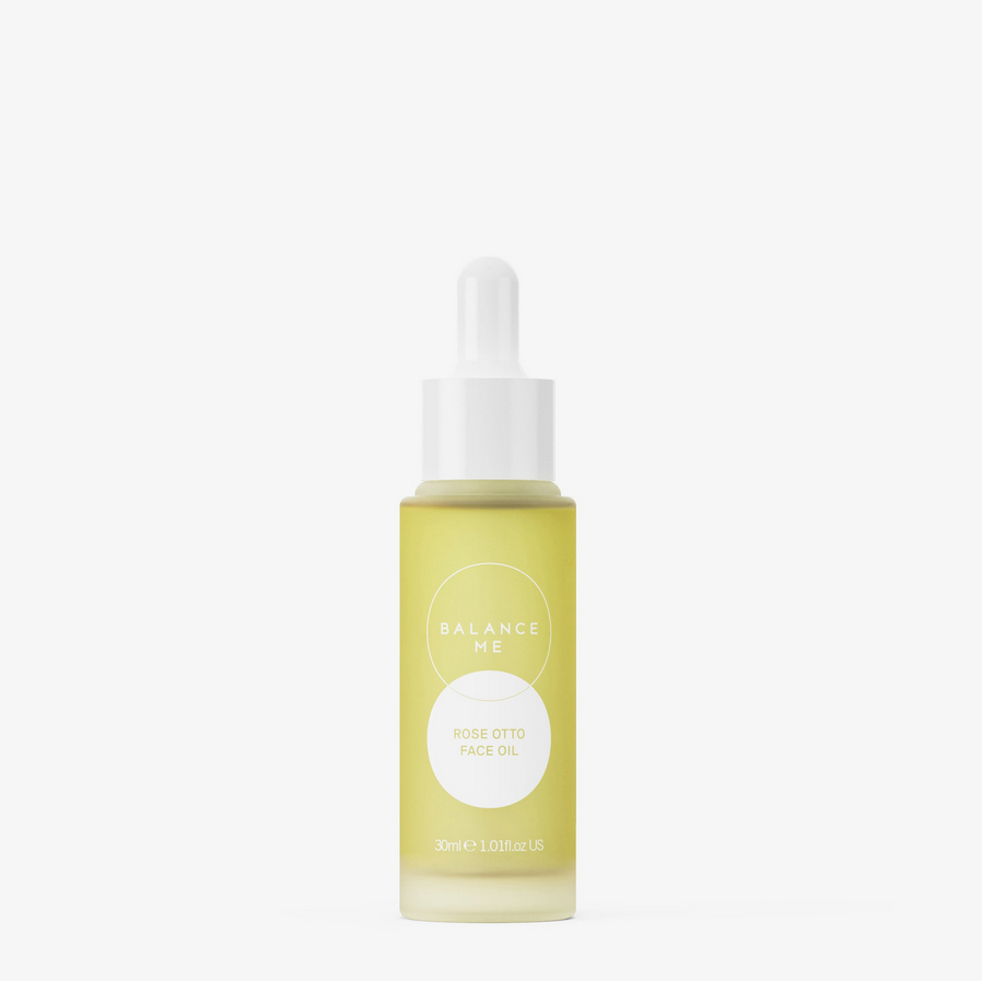 Yellow face oil bottle with dropper labeled 'Balance Me' on a white background