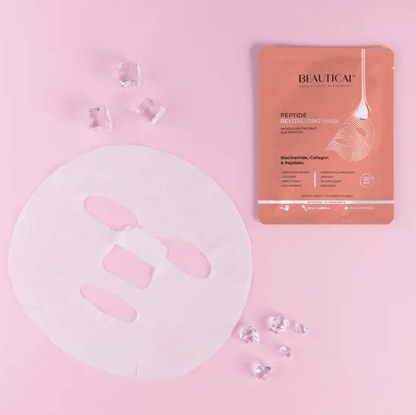 BEAUTICAL Peptide Revitalizing Mask with a sheet mask and crystals on pink background, promoting youthful skin.